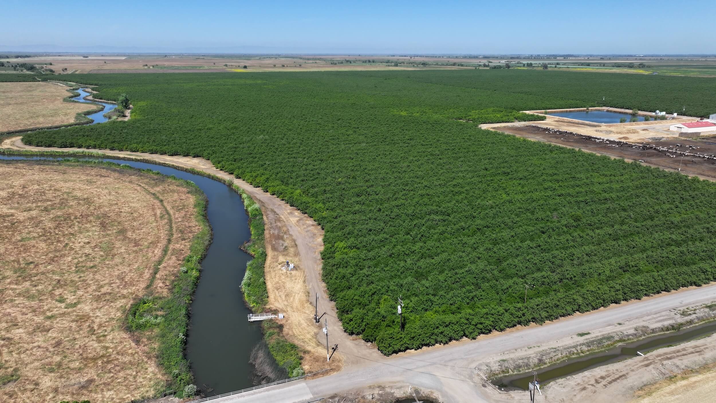 718.06 GROSS ACRES PLANTED TO ALMONDS WITH CLAIMED DIVERSION RIGHTS, A CURRENT CONTRACT WITH MERCED IRRIGATION DISTRICT AND THREE AG WELLS